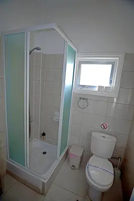 a bathroom with a shower and a toilet at Pieris Apartments in Ayia Napa