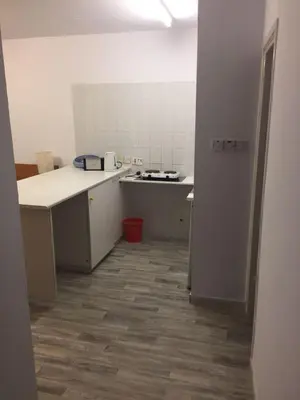 a room with a kitchen with a counter and a floor at Nautilus Tourist Apartments in Larnaka