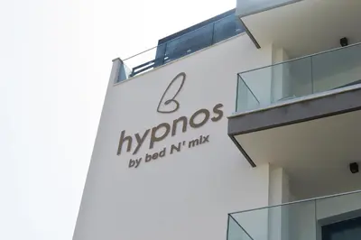 a sign on the side of a building at Hypnos Boutique Hotel in Nicosia