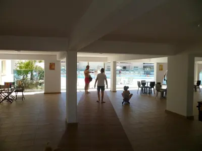 a man and a woman and a child standing in a building at Great Kings Resort Apartment 10 Block 19 in Protaras