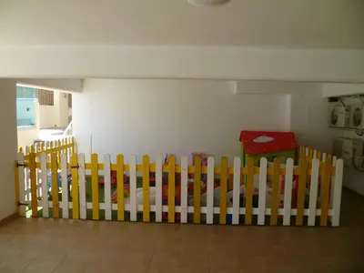 a row of wooden fences in a room at Great Kings Resort Apartment 10 Block 19 in Protaras