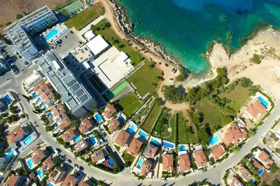 an aerial view of a city next to the ocean at Villa Celine in Protaras