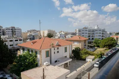 a view of a city with a house and buildings at CityDen in Larnaka