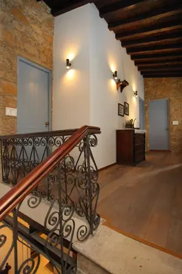 a staircase in a room with a brick wall at Centrum Hotel - City Center in Nicosia