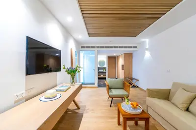 a living room with a couch and a table at Limanaki Beach Hotel & Suites in Ayia Napa