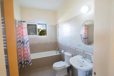 a bathroom with a toilet and a sink and a tub at Villa Orka in Protaras