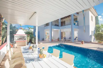 a house with a swimming pool next to a house at Villa Orka in Protaras