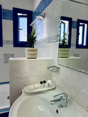 a bathroom with a sink and a mirror at Villa Jenny in Protaras