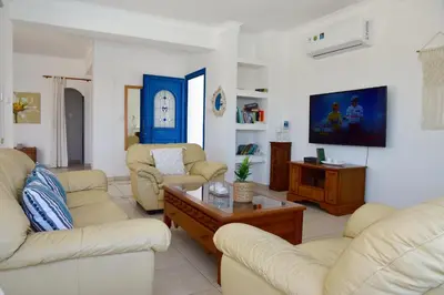 a living room with two couches and a coffee table at Villa Jenny in Protaras