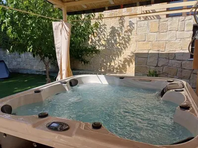 a hot tubificialificialificialificialificialificialificialificialificialificialificialificialificial at The River House in Trimiklini