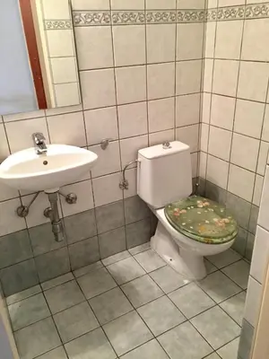 a bathroom with a toilet and a sink at Sea View Apartment in Limassol