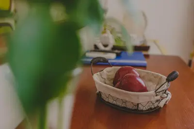 a basket of fruit sitting on a table at Alkisti City Hotel in Larnaka