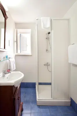 a bathroom with a shower and a sink at Alkisti City Hotel in Larnaka