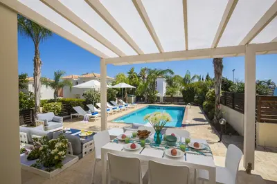 a villa with a swimming pool and a patio at Villa Mylos 7 in Protaras