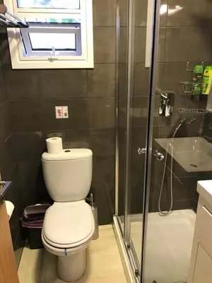 a bathroom with a toilet and a shower at Luxury Studio Ayia Napa Center in Ayia Napa