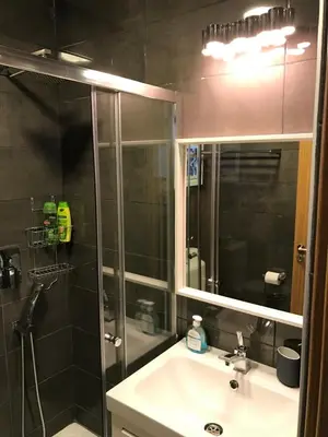 a bathroom with a shower and a sink and a mirror at Luxury Studio Ayia Napa Center in Ayia Napa