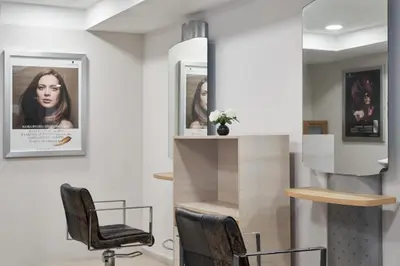 a salon with a chair and a mirror at Atlantica Oasis Hotel in Limassol