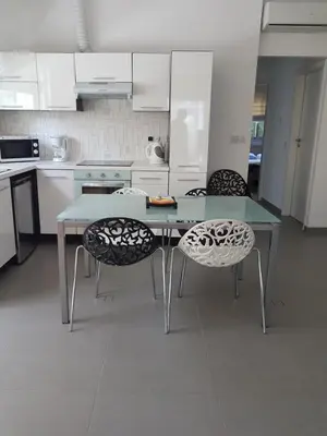 a kitchen with a table and two chairs at Julia's Residence in Nicosia