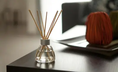 a glass vase on a table with skeins of yarn at Myrtiana Apartments in Nicosia