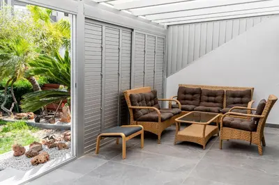 two chairs and a table on a patio at Bayview Terraces in Limassol