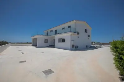 a large white house with a large driveway at Villa Marylou in Protaras