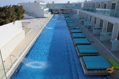 an overhead view of a swimming pool on a building at Fedrania Gardens Hotel in Ayia Napa