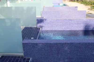 a group of purple tiles on the side of a building at Fedrania Gardens Hotel in Ayia Napa