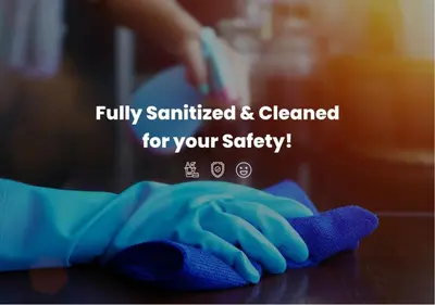 a person with a cleaning glove on a counter at Lazuli Sea View Beachfront Ap 43 in Larnaka