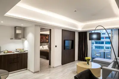 a living room with a couch and a table at Almond Business Hotel in Nicosia
