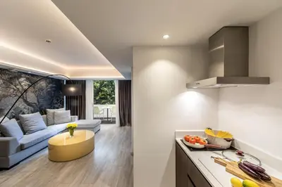 a kitchen and living room with a couch at Almond Business Hotel in Nicosia