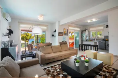 a living room with a couch and a table at Villa Ricky in Protaras