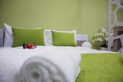 a bed with a stuffed animal sitting on top of it at Lazuli Sea View-Beachfront Ap 405 in Larnaka