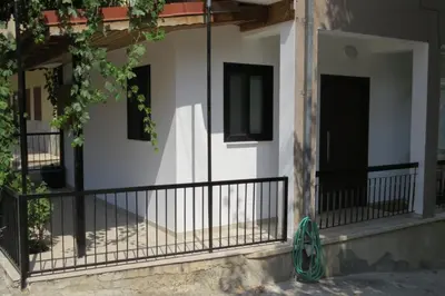a balcony of a house with black railing at River Apartments in Galata