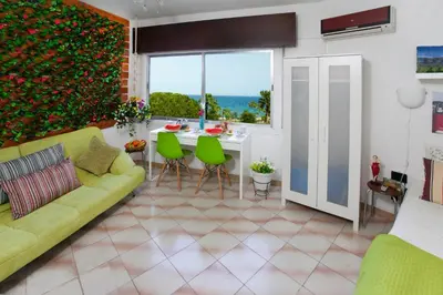 a living room with a couch and a table at Artemis Boutique Apartment 1 in Limassol