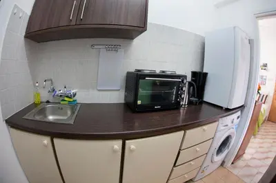 a kitchen counter with a sink and a microwave at Artemis Boutique Apartment 1 in Limassol