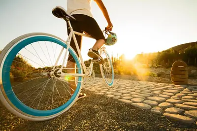 a person riding a bike with a blue tire at Aelia Wellness Retreat in Nicosia