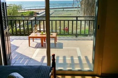 a view of a patio from a sliding glass door at Larnaka Beach House 3 in Larnaka