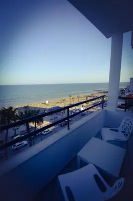 a balcony with a view of the beach and the ocean at Krasas Beach Flats in Larnaka