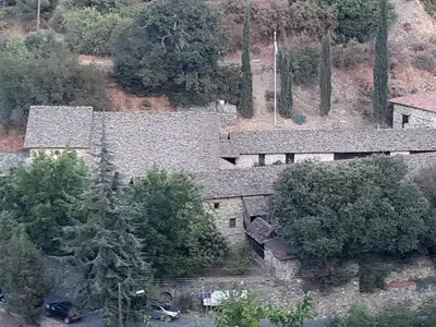 an aerial view of a house with trees at Theoxenia in Kalopanayiotis