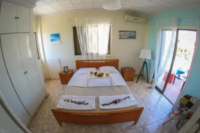 a bedroom with a bed with two towels on it at Villa Alexandra in Ayia Napa