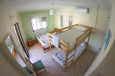 a small room with a bunk bed and a table at Villa Alexandra in Ayia Napa
