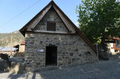 a small stone building with a window and a door at Spiti tis Irinis in Pedoulas