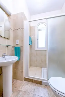 a bathroom with a shower and a sink at Villa Irina in Paralimni