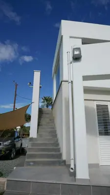 a stairway leading up to a white house at Casa Vacanze Baciata in Ayios Theodhoros