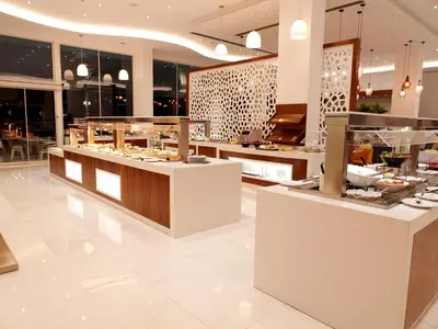 a restaurant with a buffet in a building at Amethyst Napa Hotel & Spa in Ayia Napa
