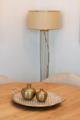two pumpkins sitting on a plate on a table at Lazuli Beachfront Sea View Ap144 in Larnaka