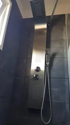 a bathroom with a shower with a shower head at Ha.De.Co. Holiday Apts in Ayia Napa