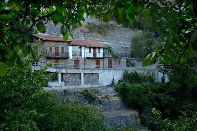 a building on the side of a hill at Arhontiko Askas Mansion in Askas