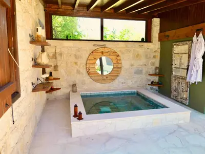 a bathroom with a jacuzzi tub in a building at Listed Villa in Laneia in Lania