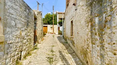 an alley in an old town with stone buildings at Listed Villa in Laneia in Lania